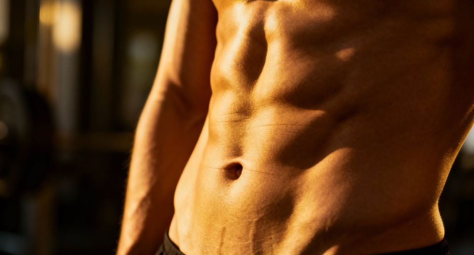 Toned abdomen with visible muscle definition.