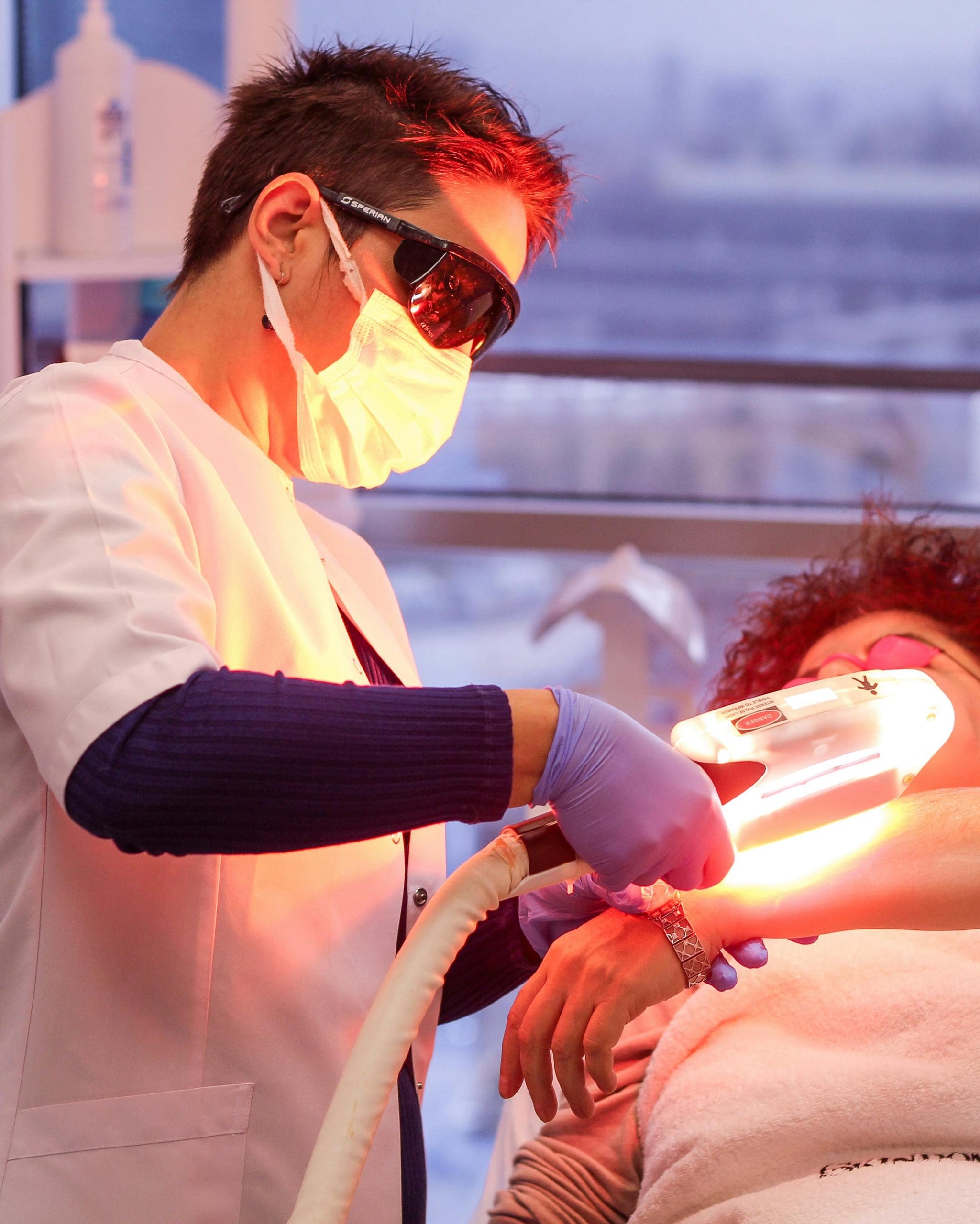 a woman getting laser treatment